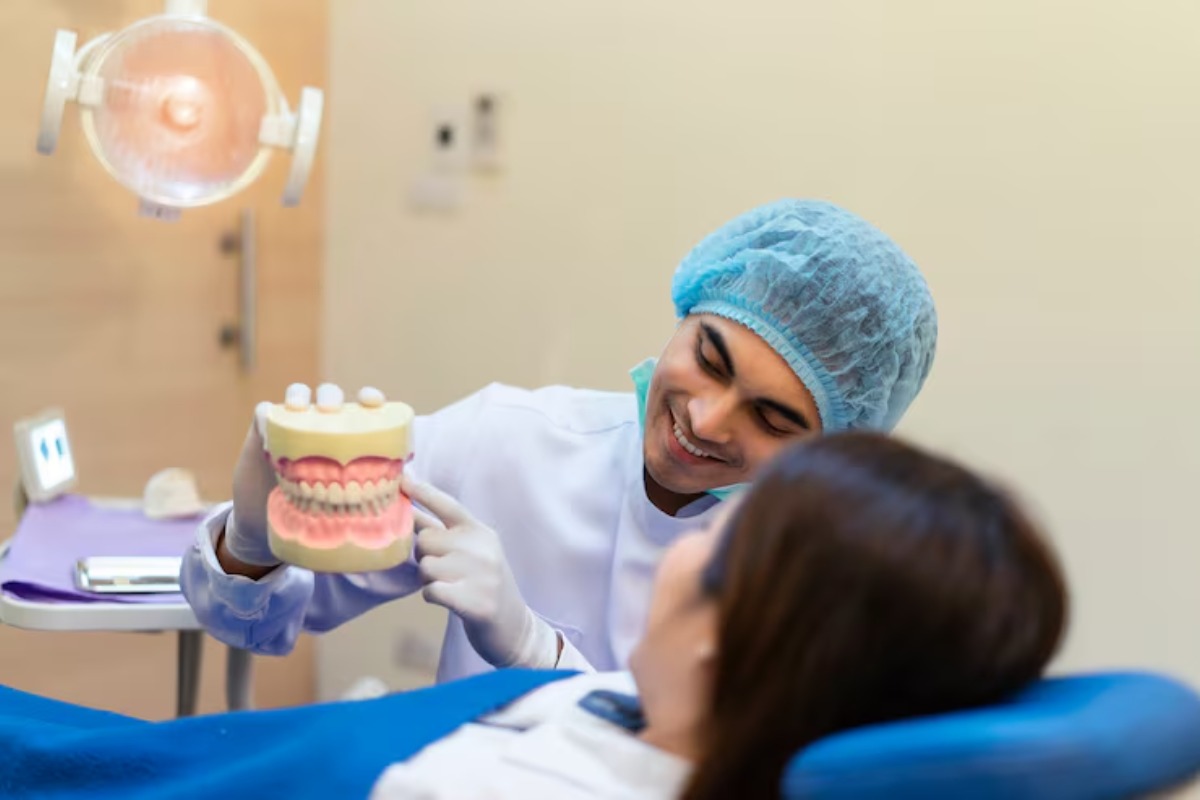 dentist explaining upper and lower dentures